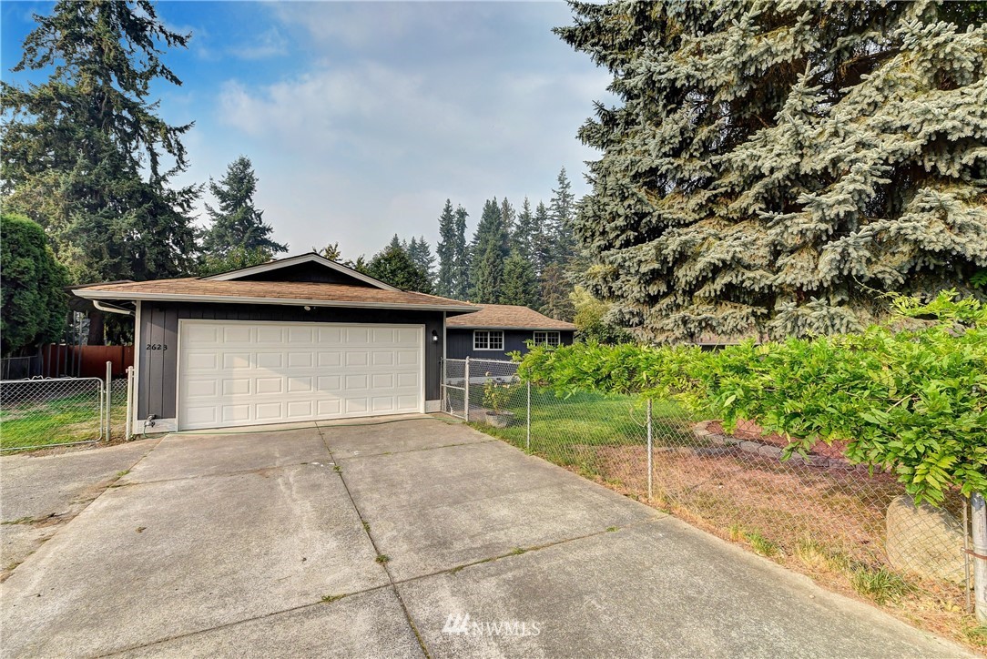 2623 171st Street Southeast Bothell, WA 98012 - Photo 25 of 26 a house with trees in the background