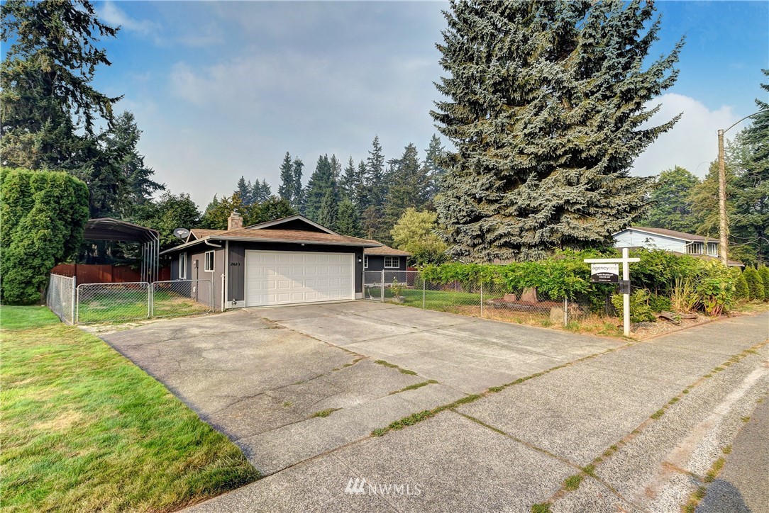 2623 171st Street Southeast Bothell, WA 98012 - Photo 26 of 26 a backyard of a house with table and chairs