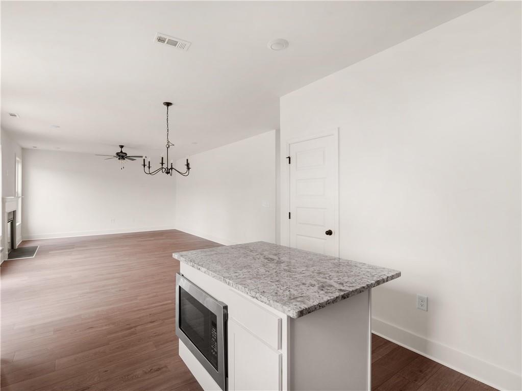 202 Loyd Road Mansfield, GA 30055 - Photo 19 of 23 a kitchen with a sink a counter space and a window