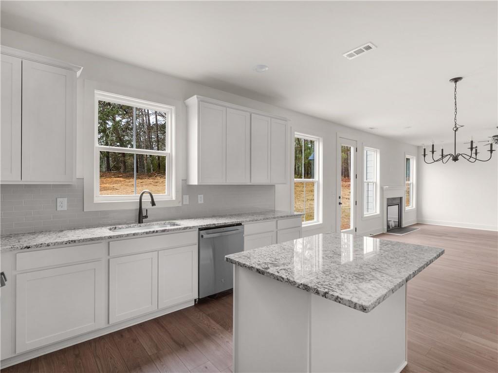 202 Loyd Road Mansfield, GA 30055 - Photo 21 of 23 a kitchen with a sink cabinets and window