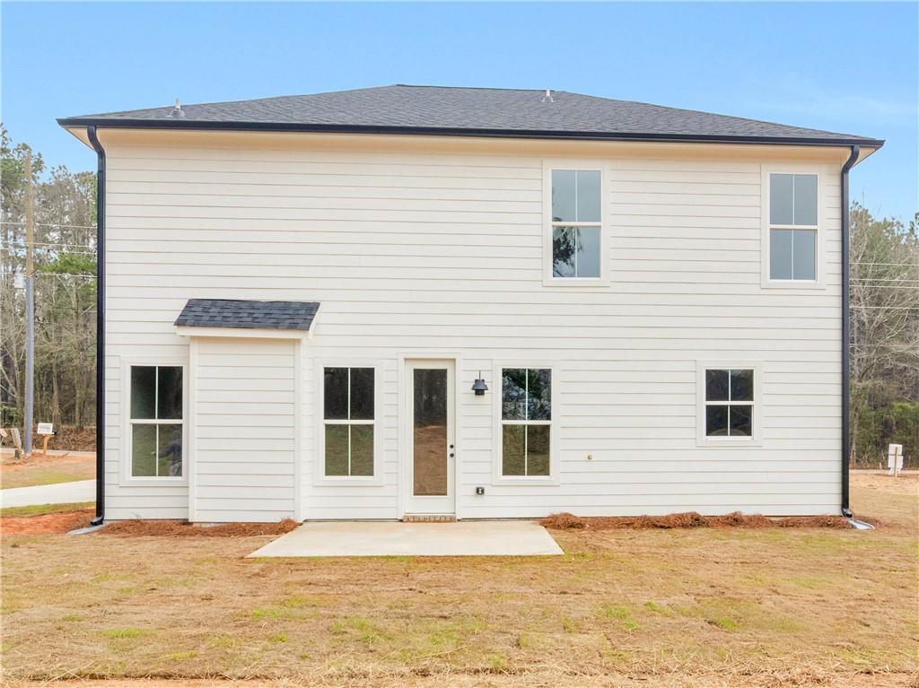 202 Loyd Road Mansfield, GA 30055 - Photo 3 of 23 a view of a house with a backyard