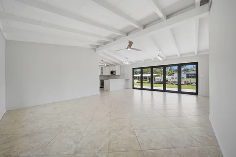 a kitchen with stainless steel appliances granite countertop a refrigerator sink and microwave