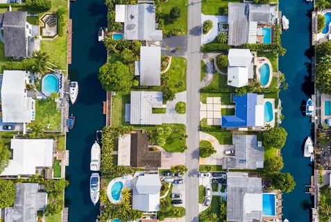 an aerial view of residential houses with outdoor space