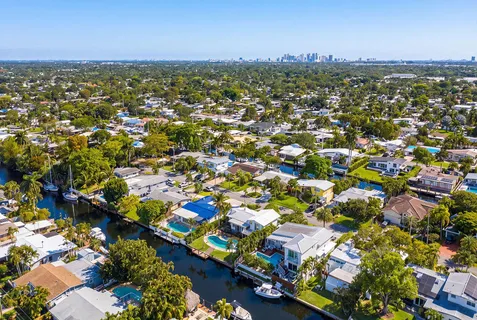 an aerial view of a houses with yard