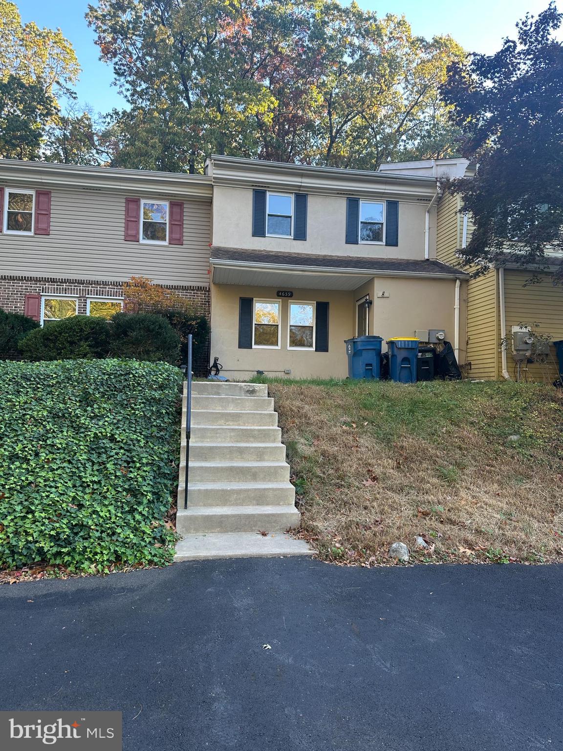 4639 Sands Way Doylestown, PA 18902 - Photo 2 of 10 a front view of a house with a yard and garage