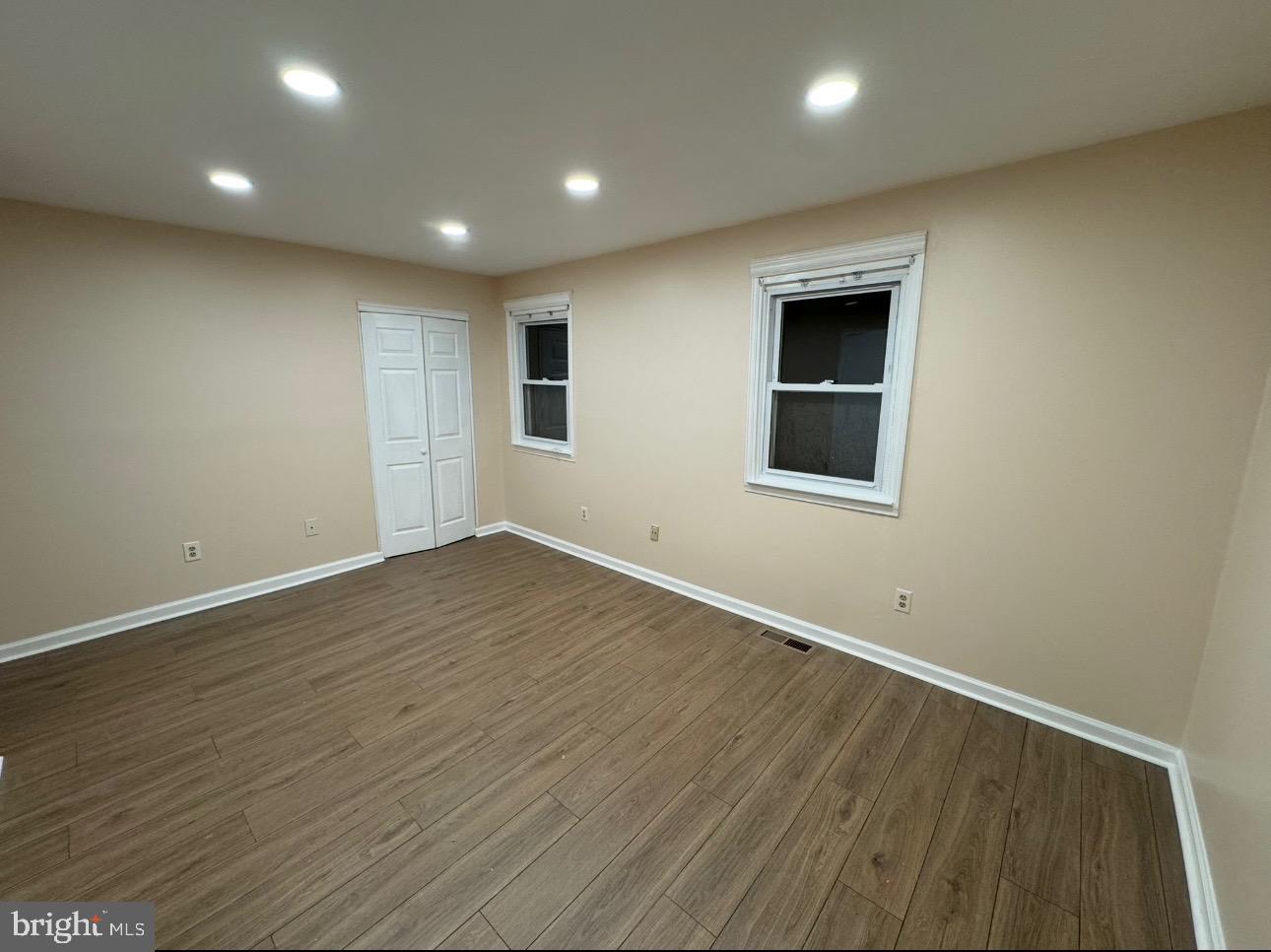 4639 Sands Way Doylestown, PA 18902 - Photo 6 of 10 an empty room with wooden floor and windows