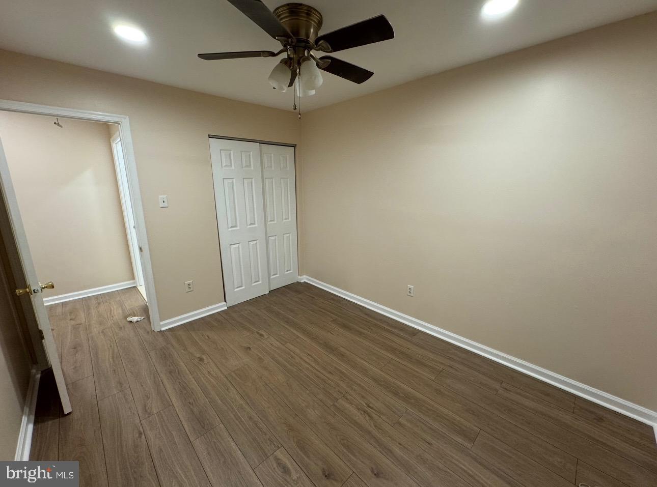 4639 Sands Way Doylestown, PA 18902 - Photo 7 of 10 an empty room with wooden floor and windows