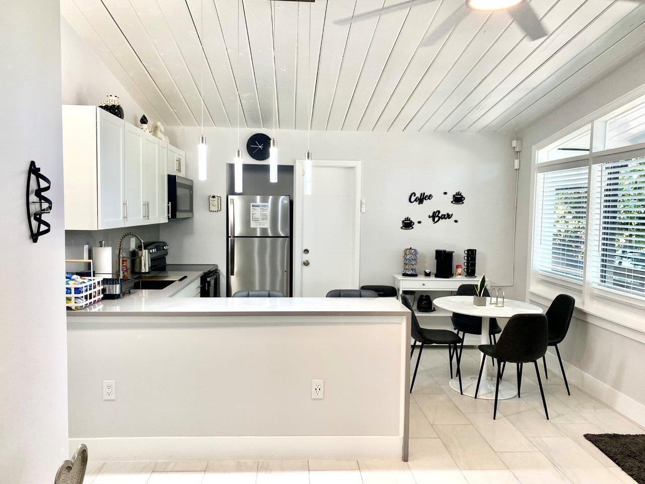462 Hastings Street Boca Raton, FL 33487 - Photo 16 of 28 a living room with stainless steel appliances kitchen island granite countertop a sink and a cabinets