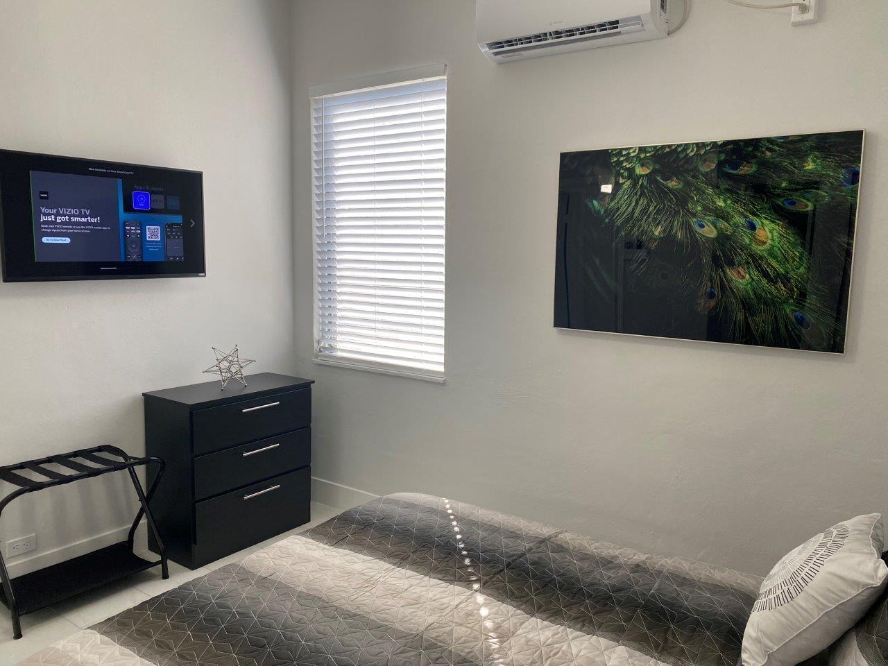 462 Hastings Street Boca Raton, FL 33487 - Photo 18 of 28 a room with a bed and a television