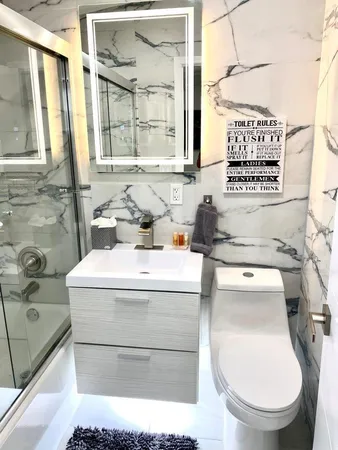 a bathroom with a tub and a shower