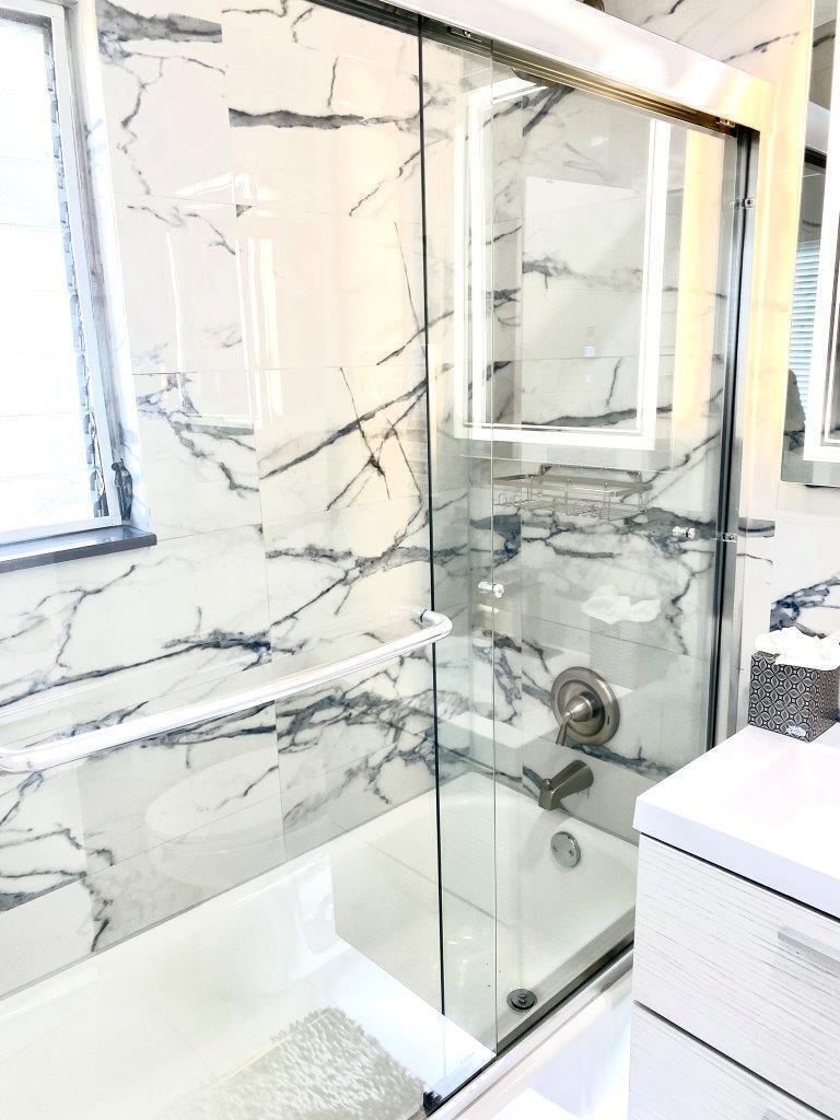 462 Hastings Street Boca Raton, FL 33487 - Photo 21 of 28 a bathroom with a tub and a shower