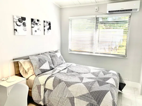 a living room with furniture and windows