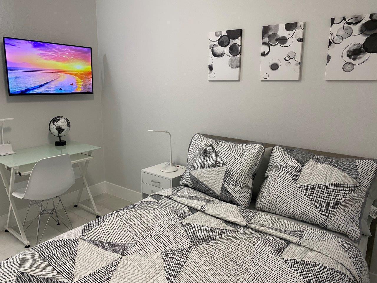 462 Hastings Street Boca Raton, FL 33487 - Photo 9 of 28 a bedroom with a bed and couch