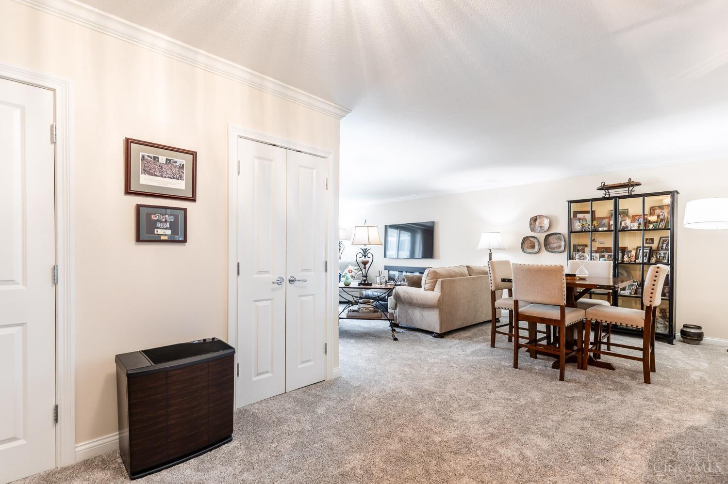 2444 Madison Road, Unit 901 Cincinnati, OH 45208 - Photo 2 of 44 The entry greets you with a convenient coat closet and wall-to-wall carpet. The entry is open to the living room.