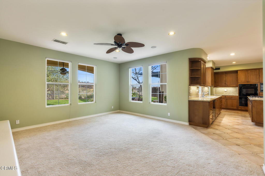 3710 Sunset Ridge Road Altadena, CA 91001 - Photo 15 of 45 a view of an empty room with a window and a kitchen