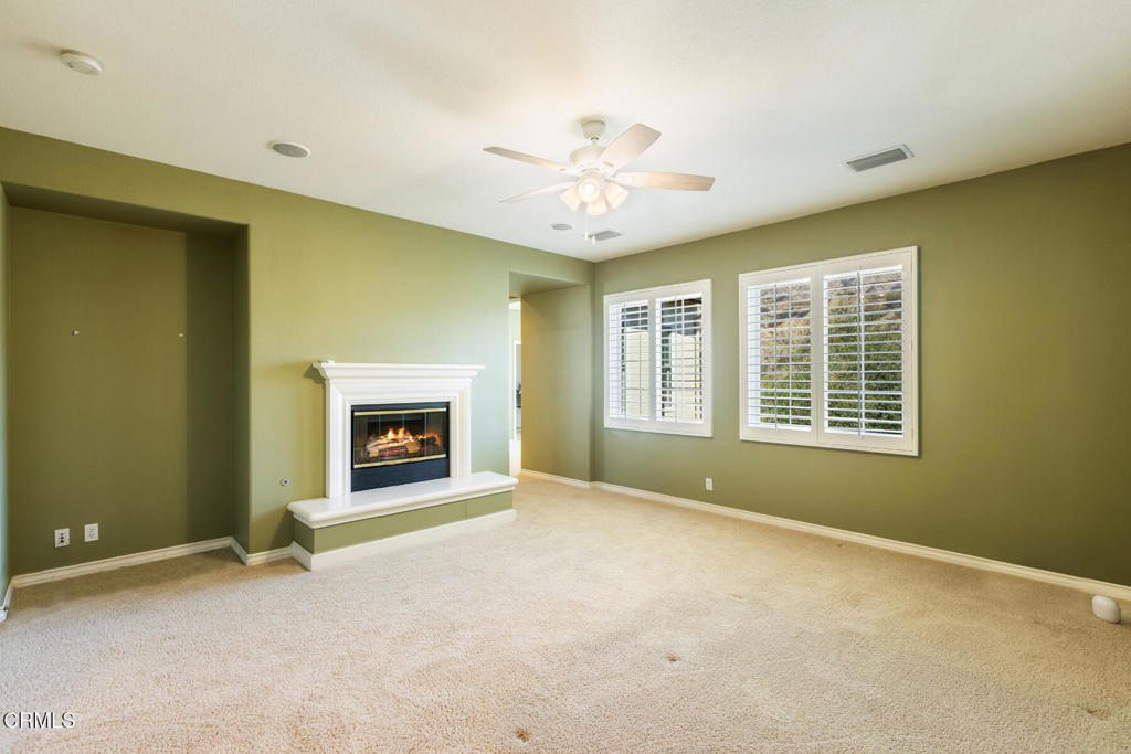 3710 Sunset Ridge Road Altadena, CA 91001 - Photo 17 of 45 a view of an empty room with a window and fireplace