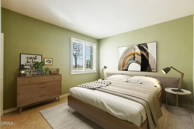 a bedroom with a bed and window