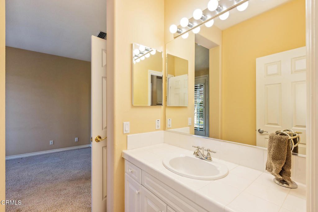 3710 Sunset Ridge Road Altadena, CA 91001 - Photo 30 of 45 a bathroom with a sink and a mirror