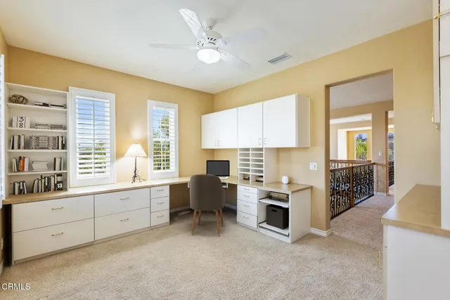 a view of living room with furniture and fireplace