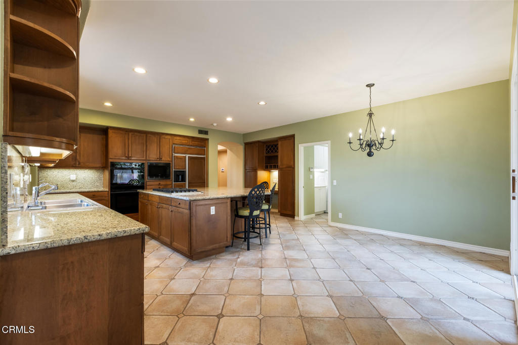 3710 Sunset Ridge Road Altadena, CA 91001 - Photo 10 of 45 a kitchen with stainless steel appliances granite countertop a sink and a stove