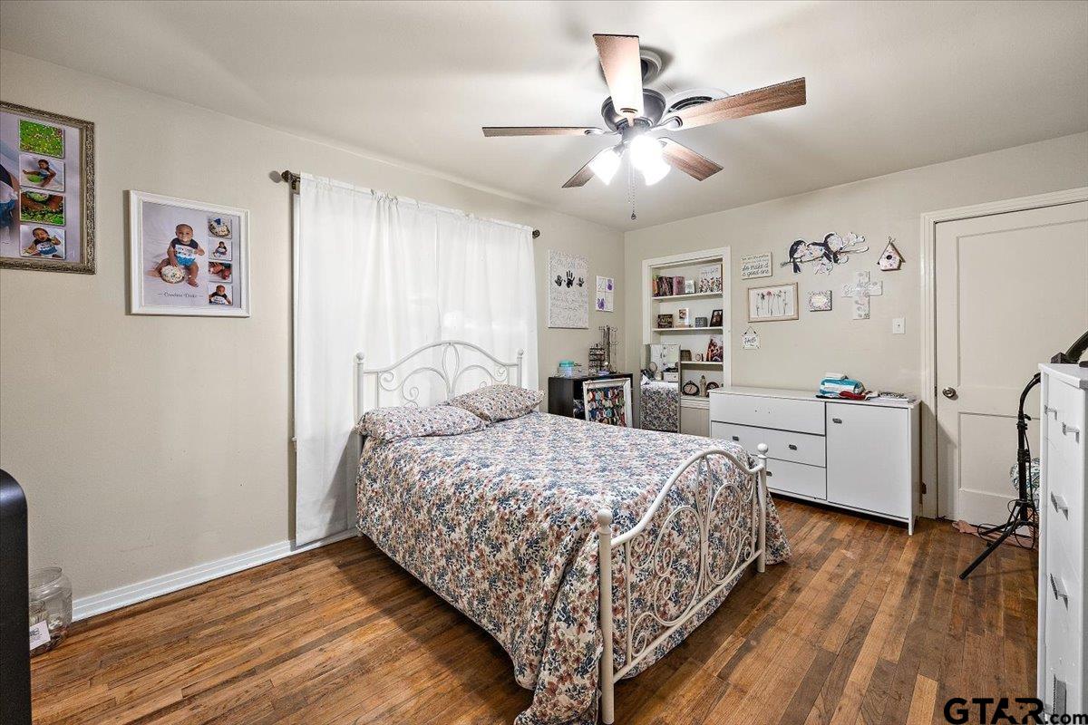 228 Fairview Street Rusk, TX 75785 - Photo 19 of 35 a bedroom with a large bed and a window