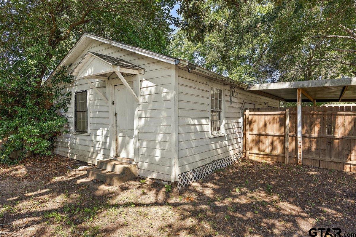 228 Fairview Street Rusk, TX 75785 - Photo 34 of 35 a backyard of a house with table and chairs