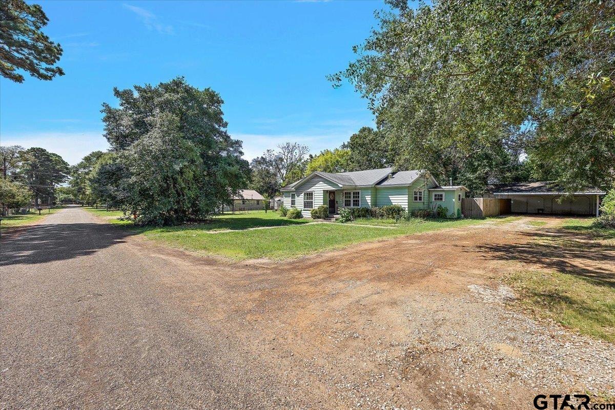 228 Fairview Street Rusk, TX 75785 - Photo 9 of 35 a view of swimming pool with a yard and large trees