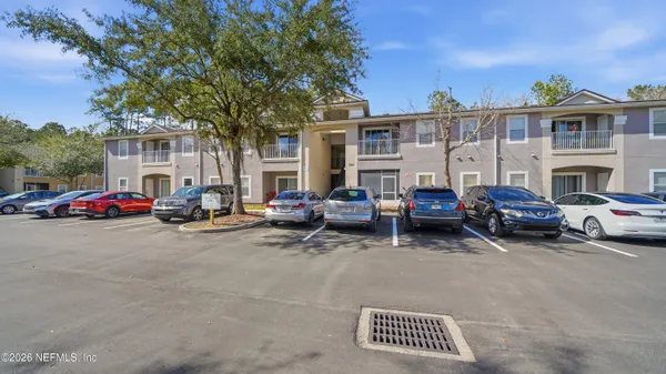a group of cars parked in front of a house