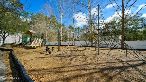 a view of a backyard of the house