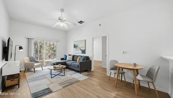 a living room with furniture and a large window