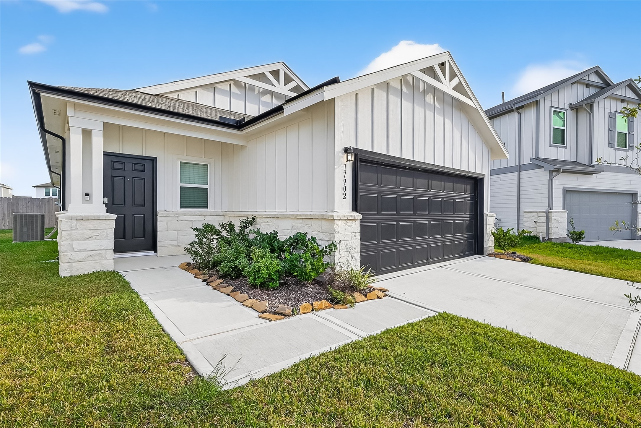 17902 Slurry Rake Lane Hockley, TX 77447 - Photo 1 of 32 a front view of a house with garden