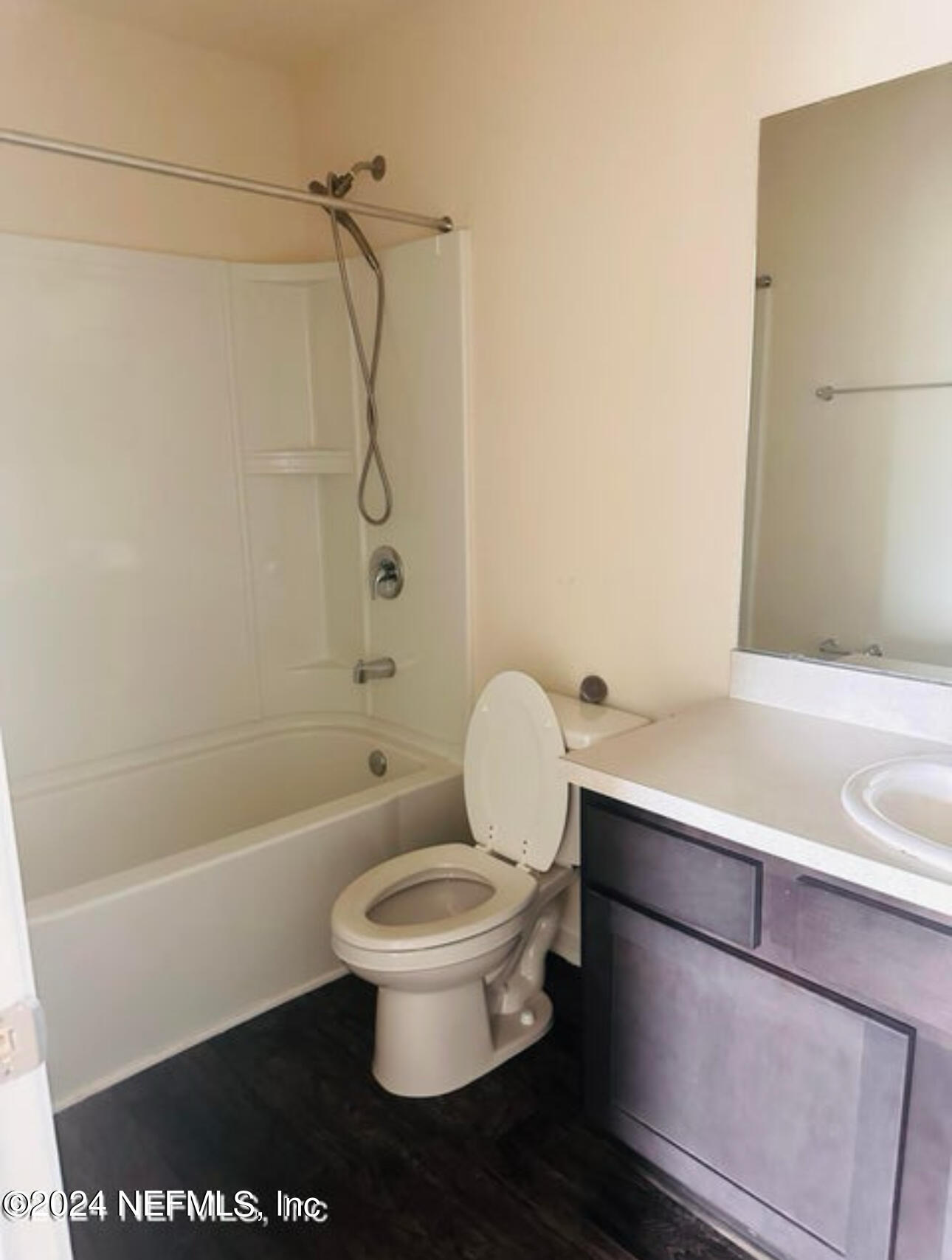 7945 Echo Springs Road Jacksonville, FL 32256 - Photo 7 of 10 a bathroom with a toilet a sink and a shower