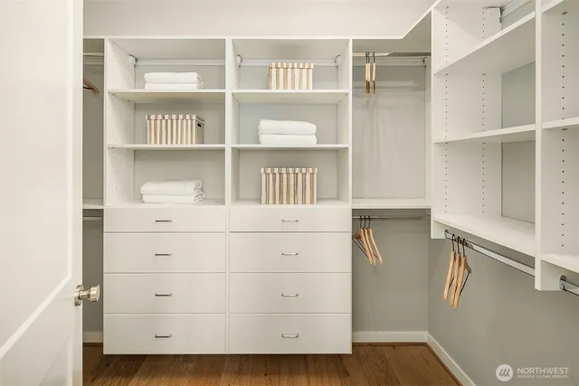a view of walk in closet with empty racks