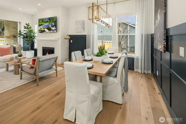 a living room with furniture wooden floor and a fireplace