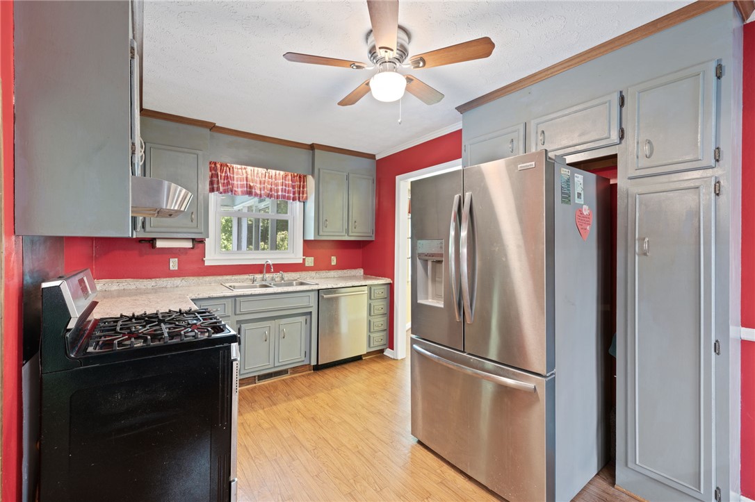 200 Echo Circle Easley, SC 29642 - Photo 3 of 35 A well-equipped kitchen features a stainless steel refrigerator and ample cabinetry for storage.