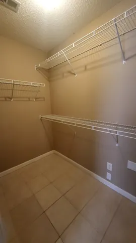 a view of a room with racks on the wall