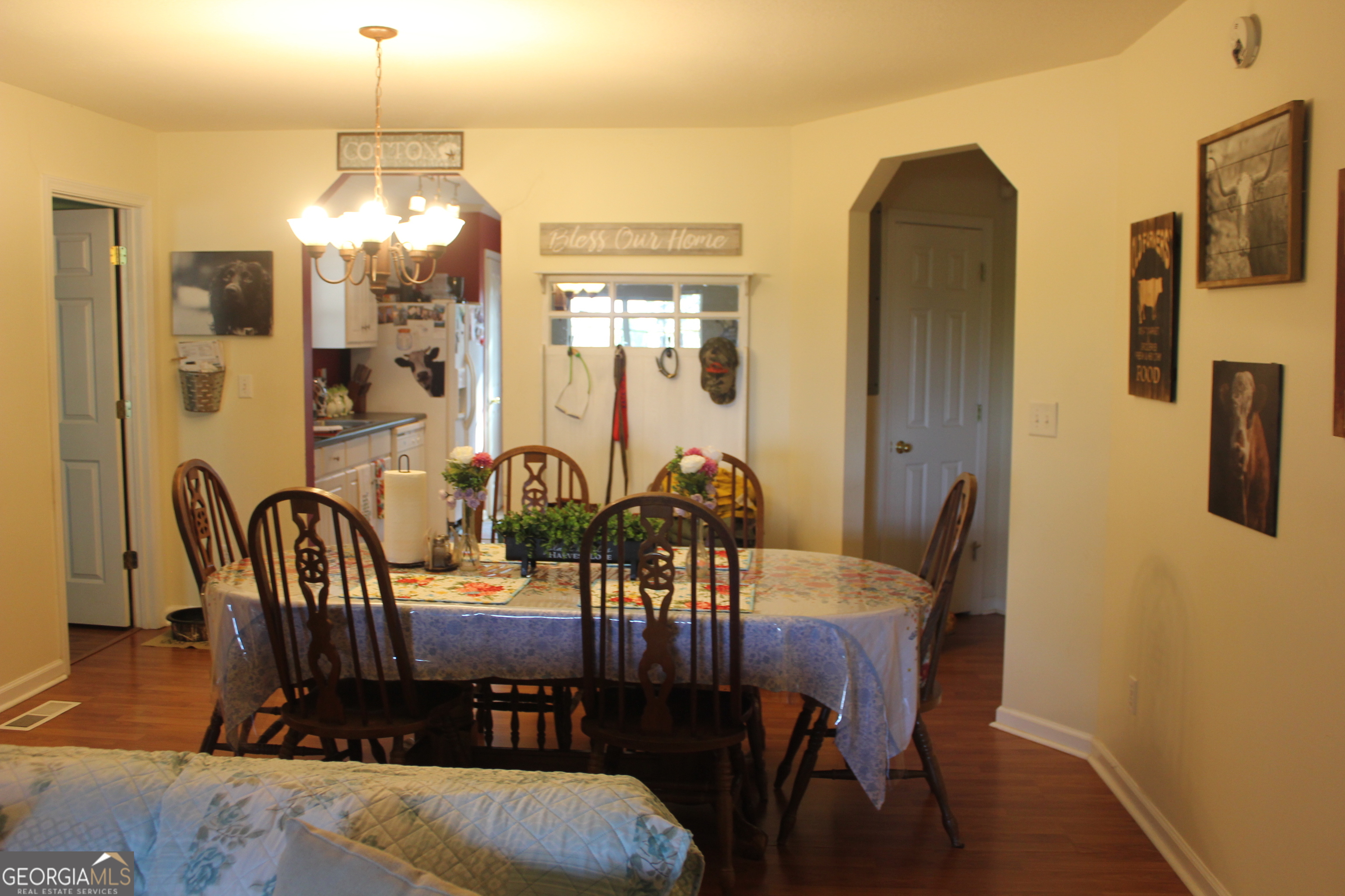 2850 Isaac Akins Road Statesboro, GA 30458 - Photo 11 of 29 a view of a dining room with furniture window and wooden floor