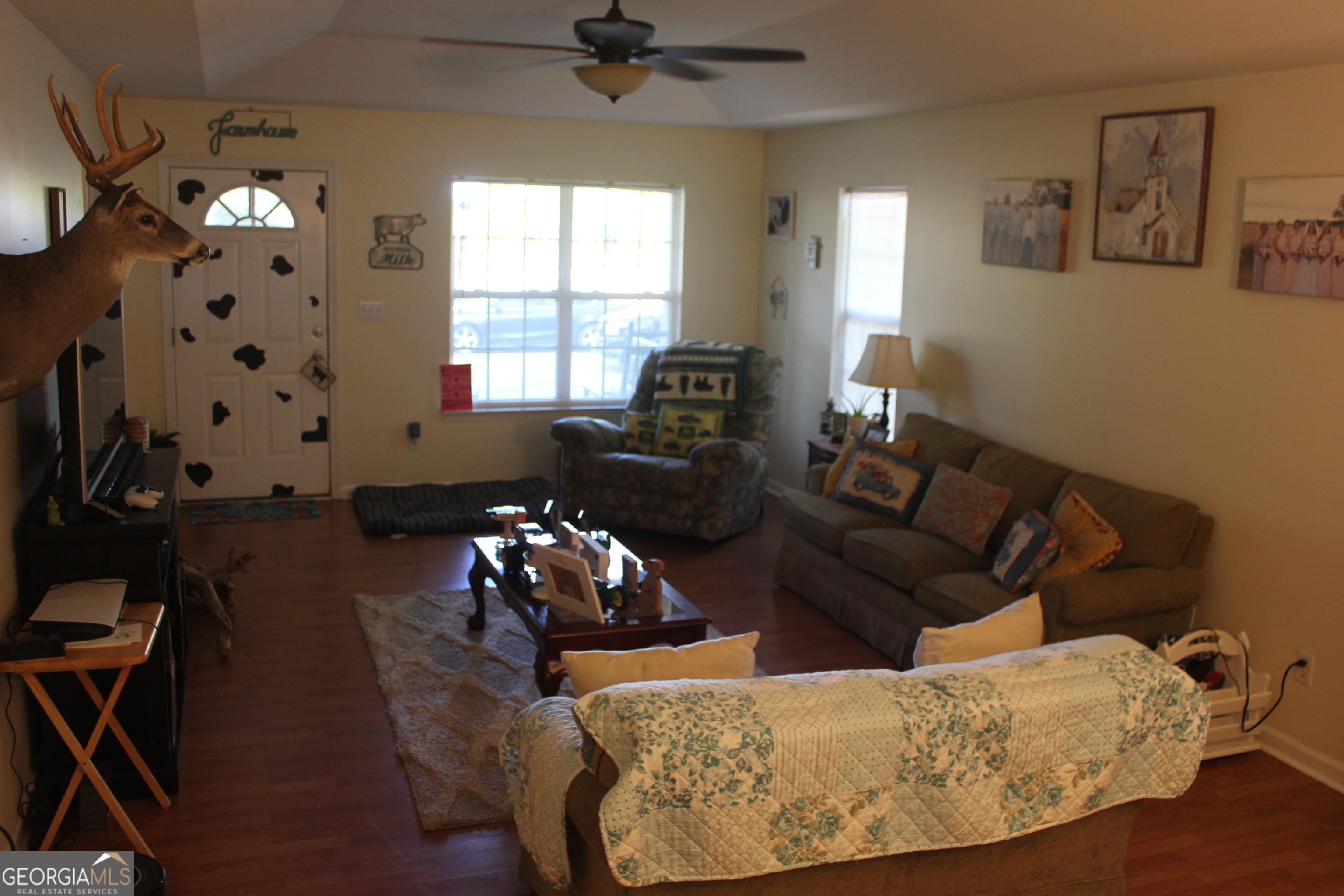 2850 Isaac Akins Road Statesboro, GA 30458 - Photo 12 of 29 a living room with furniture and a large window