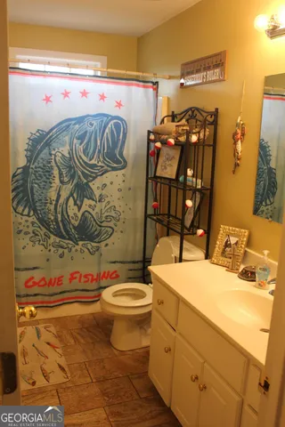 a bathroom with a sink and mirror