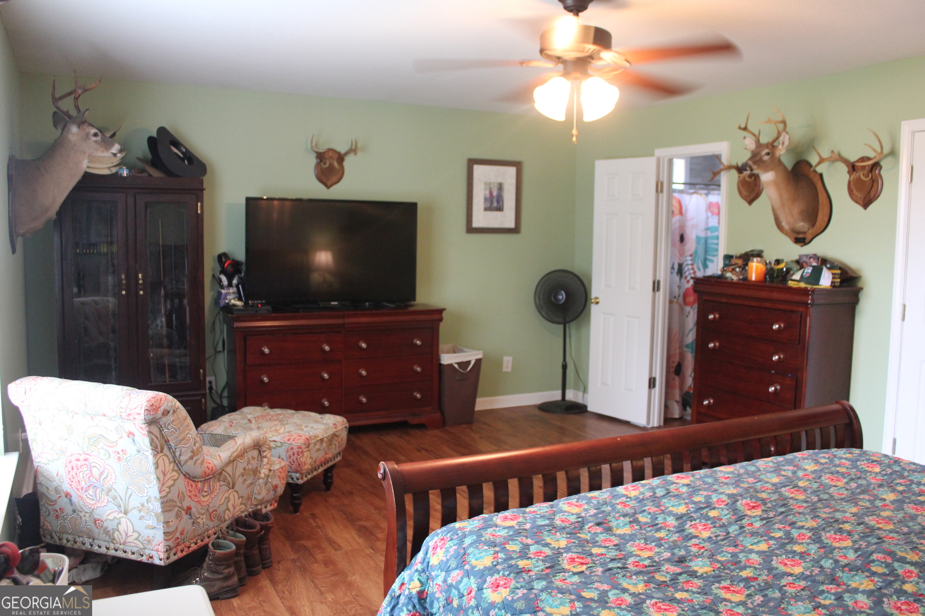 2850 Isaac Akins Road Statesboro, GA 30458 - Photo 20 of 29 a bedroom with a bed and a flat screen tv