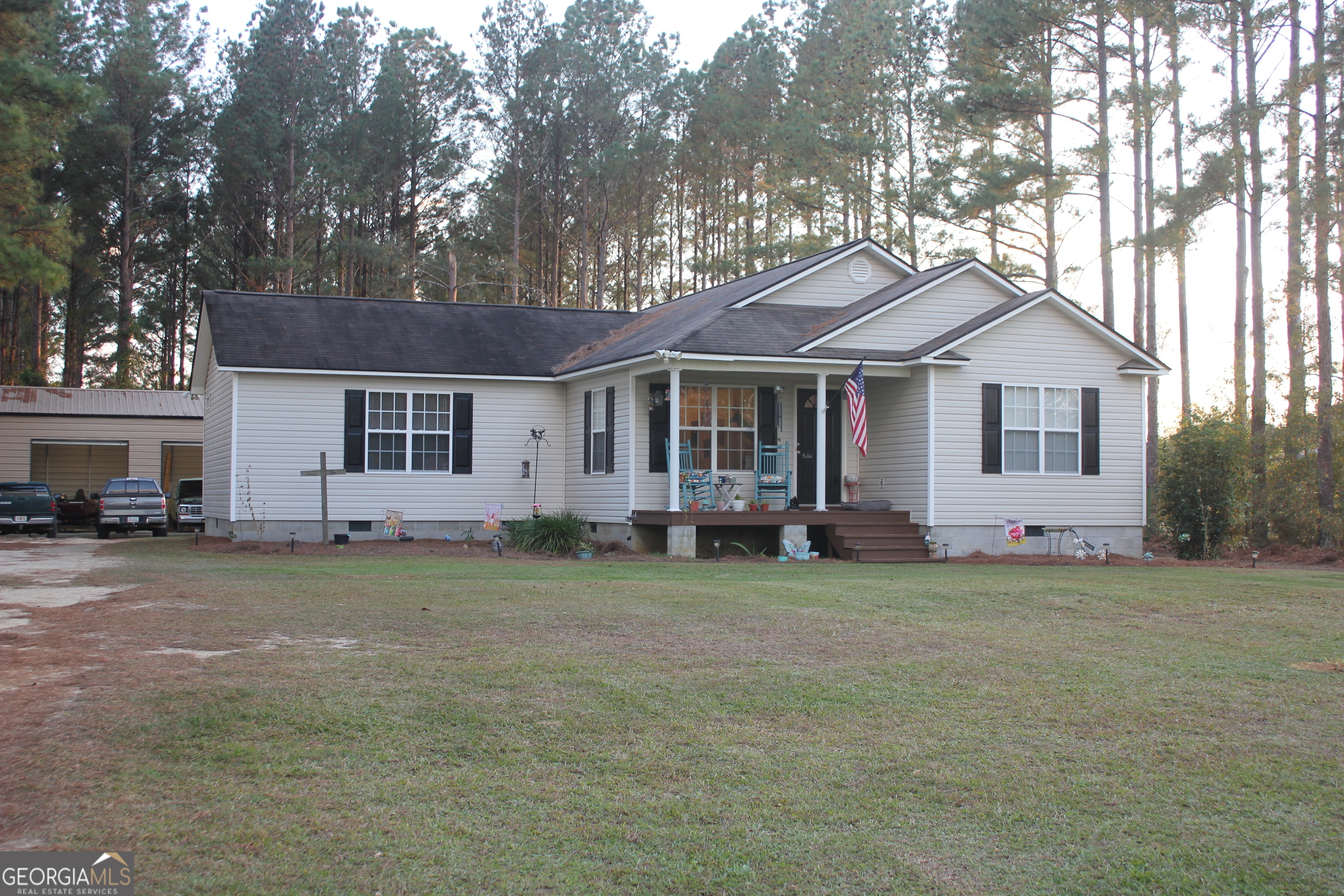 2850 Isaac Akins Road Statesboro, GA 30458 - Photo 2 of 29 a white house that has a tree in front of it