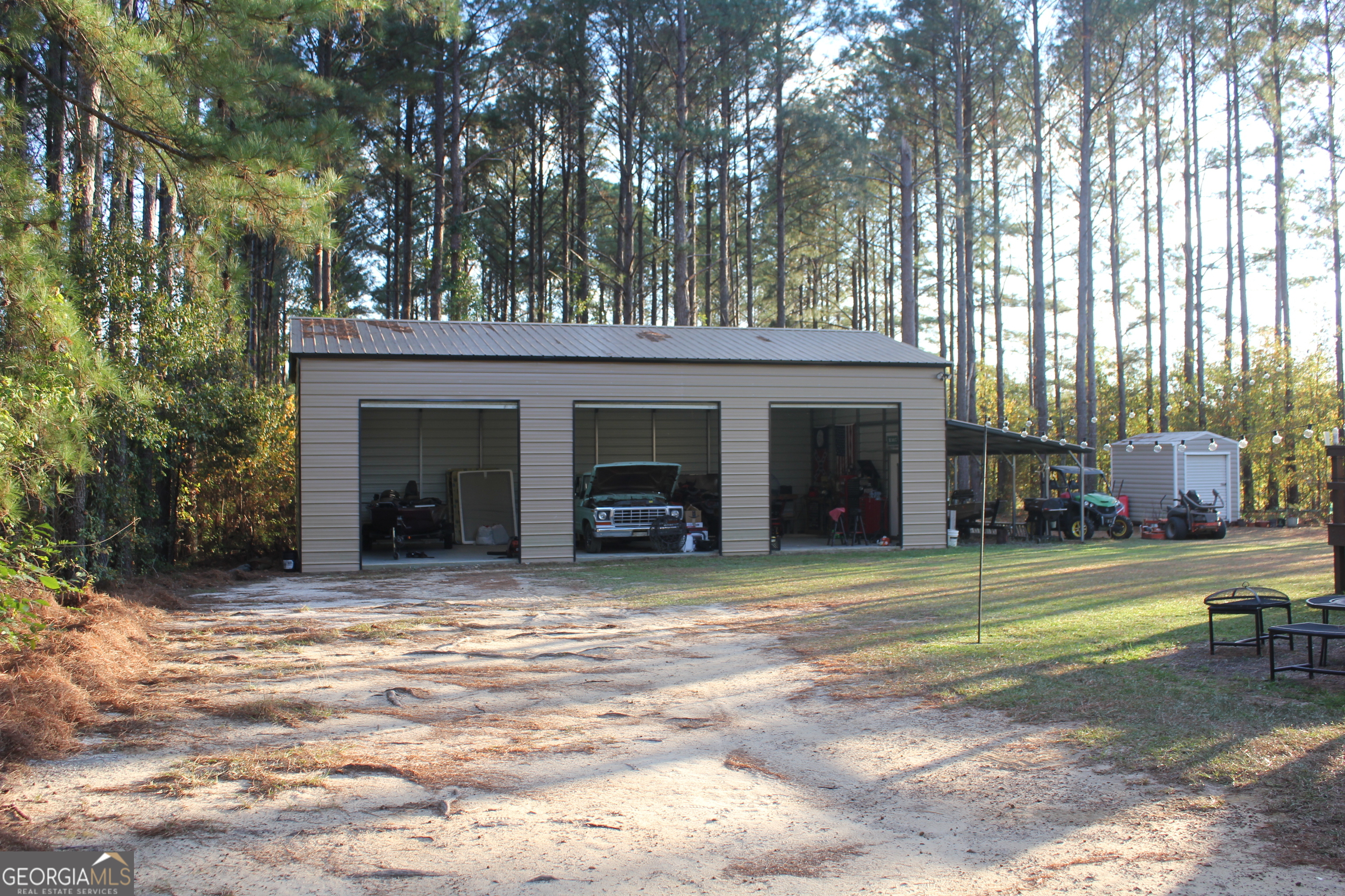 2850 Isaac Akins Road Statesboro, GA 30458 - Photo 28 of 29 a view of a house with a yard and sitting area