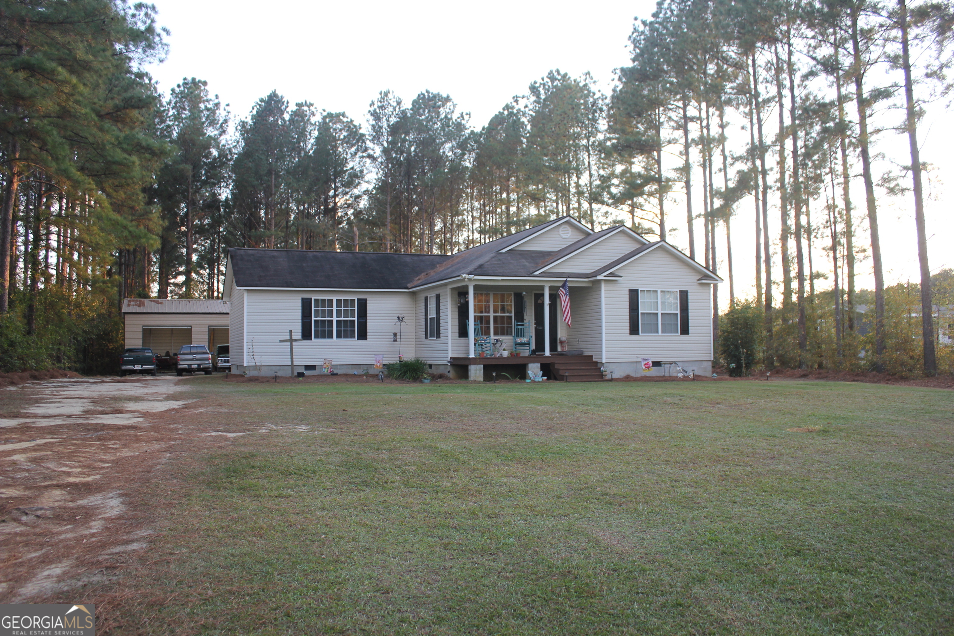 2850 Isaac Akins Road Statesboro, GA 30458 - Photo 3 of 29 a front view of a house with a garden