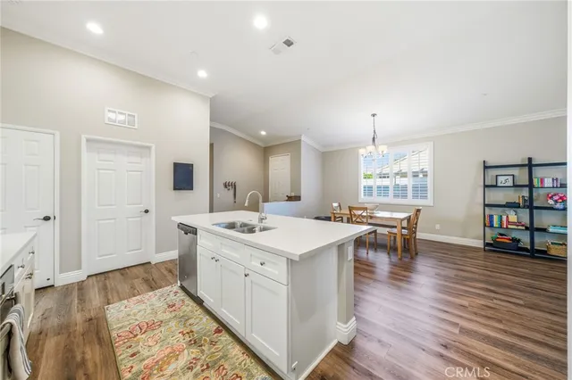 a open kitchen with stainless steel appliances granite countertop a sink and cabinets