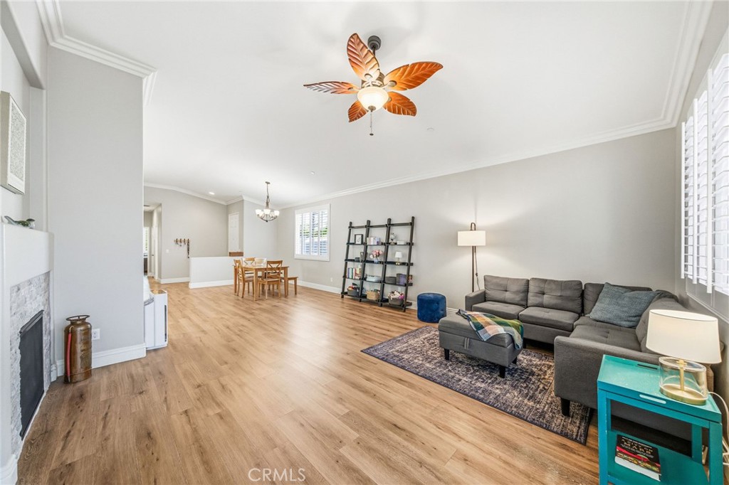 26535 Rim Creek Path, Unit PATHWAY Menifee, CA 92584 - Photo 21 of 50 a living room with furniture and a wooden floor