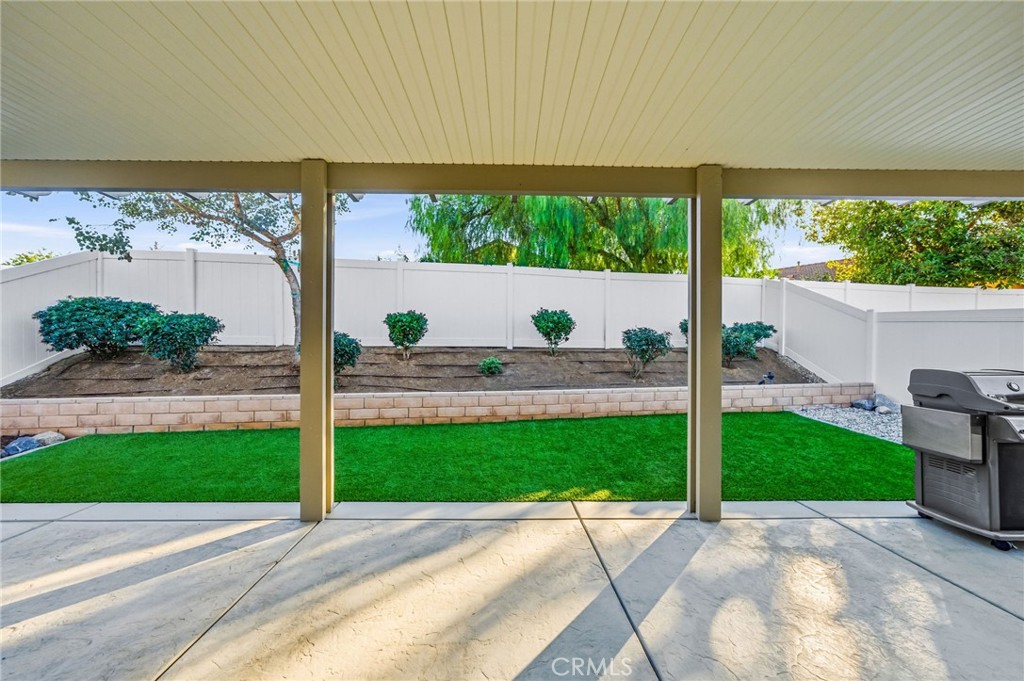 26535 Rim Creek Path, Unit PATHWAY Menifee, CA 92584 - Photo 35 of 50 a view of a patio with a yard