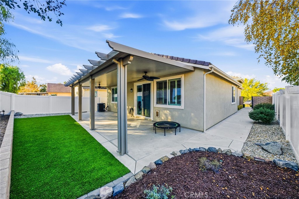 26535 Rim Creek Path, Unit PATHWAY Menifee, CA 92584 - Photo 38 of 50 a view of a house with a backyard