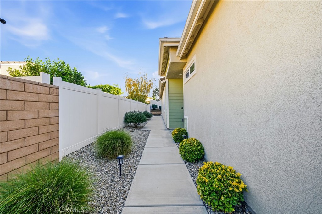 26535 Rim Creek Path, Unit PATHWAY Menifee, CA 92584 - Photo 4 of 50 a view of a pathway in outside of the house