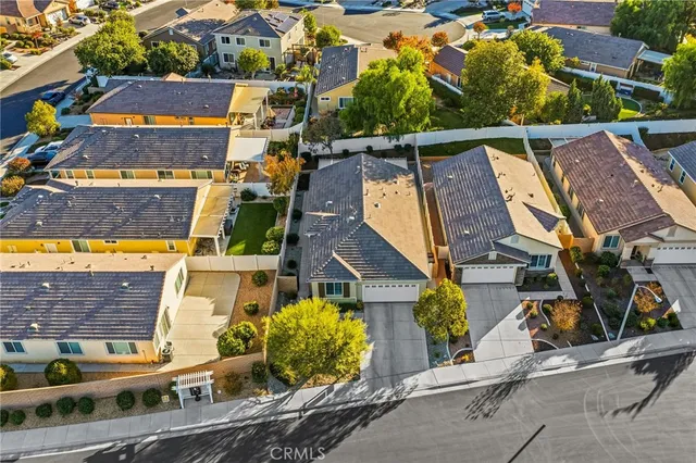 an aerial view of houses with street