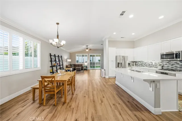 a view of a kitchen and dining room